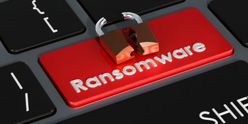 Ransomware red button on keyboard, 3D rendering