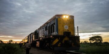 A commuter train known as the 'Freedom Train' approaches a station early morning on January 29, 2019 in Cowdray Park township, in Bulawayo, Zimbabwe. - Zimbabwe's only commuter train is cheap and reliable -- two qualities that its passengers cherish in a downwards-spiralling economy. (Photo by Zinyange Auntony / AFP)        (Photo credit should read ZINYANGE AUNTONY/AFP via Getty Images)