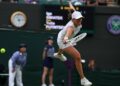 Poland's Iga Swiatek misses a return against Kazakhstan's Yulia Putintseva during their women's singles tennis match on the sixth day of the 2024 Wimbledon Championships at The All England Lawn Tennis and Croquet Club in Wimbledon, southwest London, on July 6, 2024. Putintseva won the third round match 3-6, 6-1, 6-2. (Photo by HENRY NICHOLLS / AFP) / RESTRICTED TO EDITORIAL USE